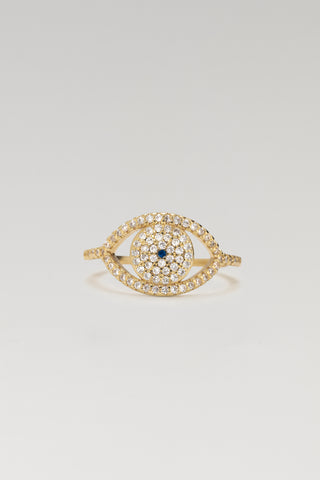 Protective Eye ring, gold plated, front view of the pave cubic zirconia eye with a blue centre stone