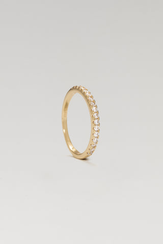 Livia ring, gold plated, standing on edge to show the slim line of pave-set cubic zirconia