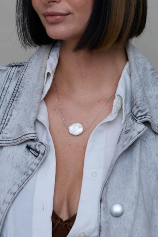 Alba Necklace silver layered with silver chain necklaces on model