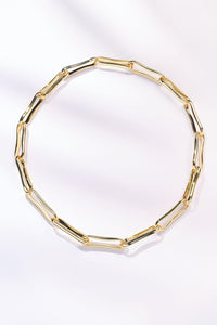 Delphine necklace gold elongated link chain on white background