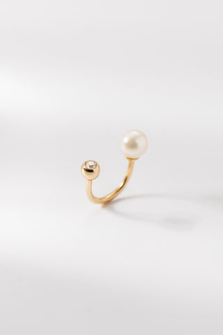 Margaux flat back earring in gold featuring a pearl and crystal on a white background