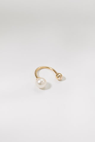 Close-up of Margaux flat back earring showing pearl and crystal setting in gold