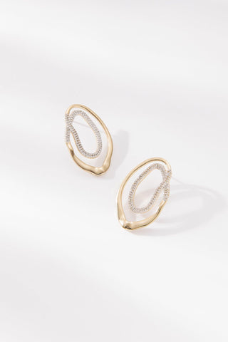 Valentina Earrings by One Dame Lane, sculptural gold statement earrings with pavé crystal inner detail.