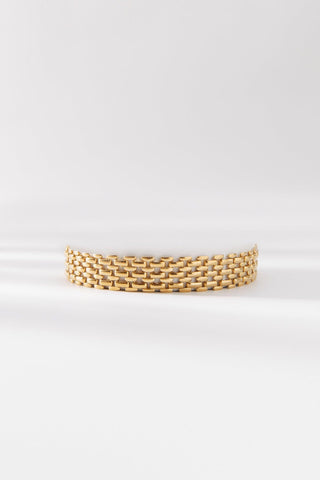 Vivienne Bracelet by One Dame Lane, featuring a sculptural woven matte gold chain design with rich texture and flexible links.