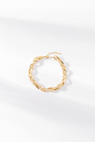 Gold Zara chain bracelet with polished elongated links on a white background