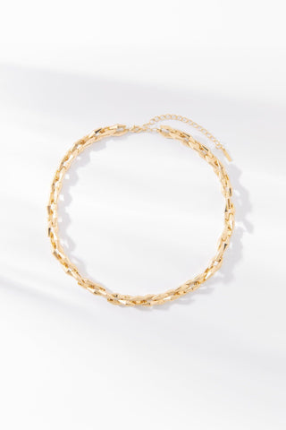 Zara gold chain necklace with elongated polished links on a white background